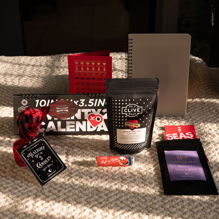 Collection of stationery items including a tea bag, a calendar, and other small products